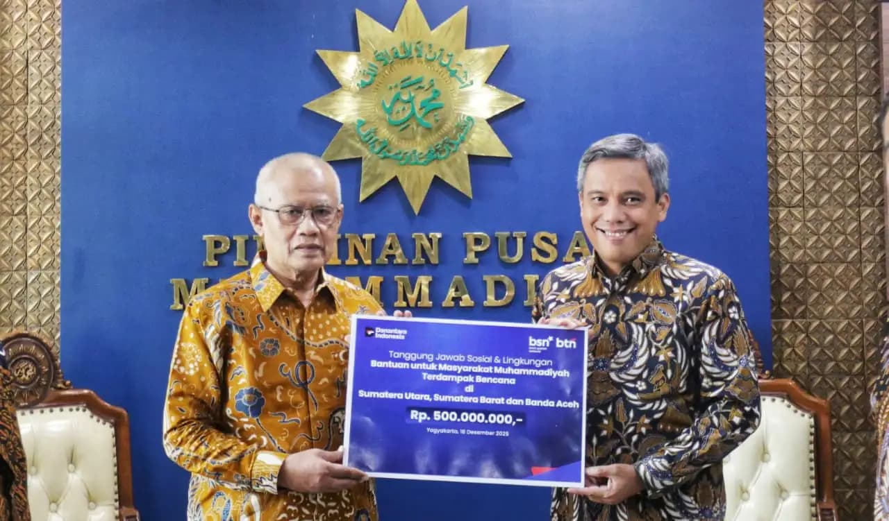 Dirut BTN Nixon LP Napitupulu dan Ketua Umum Pimpinan Pusat Muhammadiyah Prof Haedar Nashir (Foto: BTN)